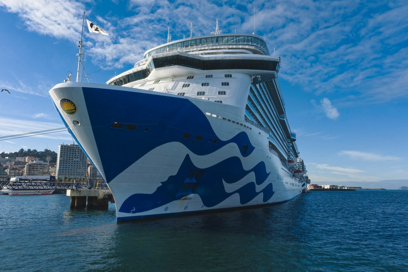 A large cruise ship docked in a harbor