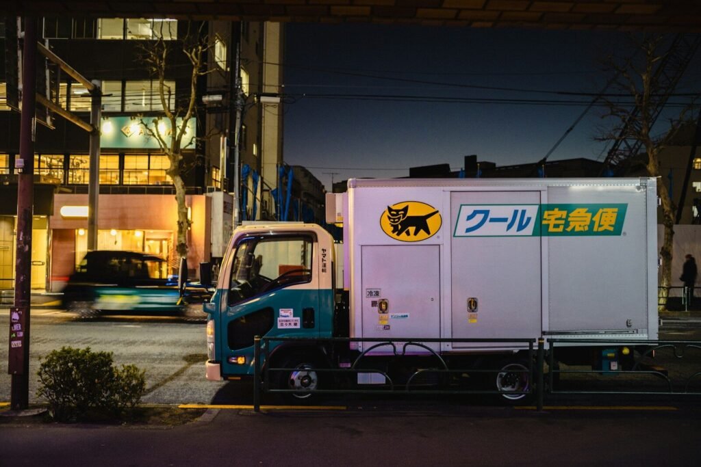 Delivery truck parked on a city street at night